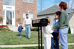 Photo: Family members meeting by their mailbox. You should pick two meeting places, one close to your home and one farther away.